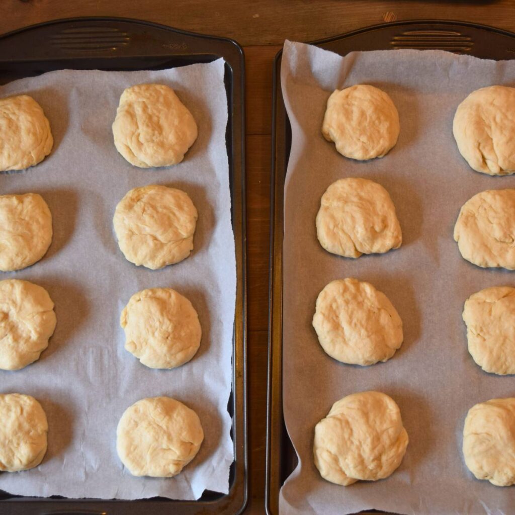 Super Simple Cheesy Buns Separated into Small dough balls and placed on cooking sheet with parchment paper