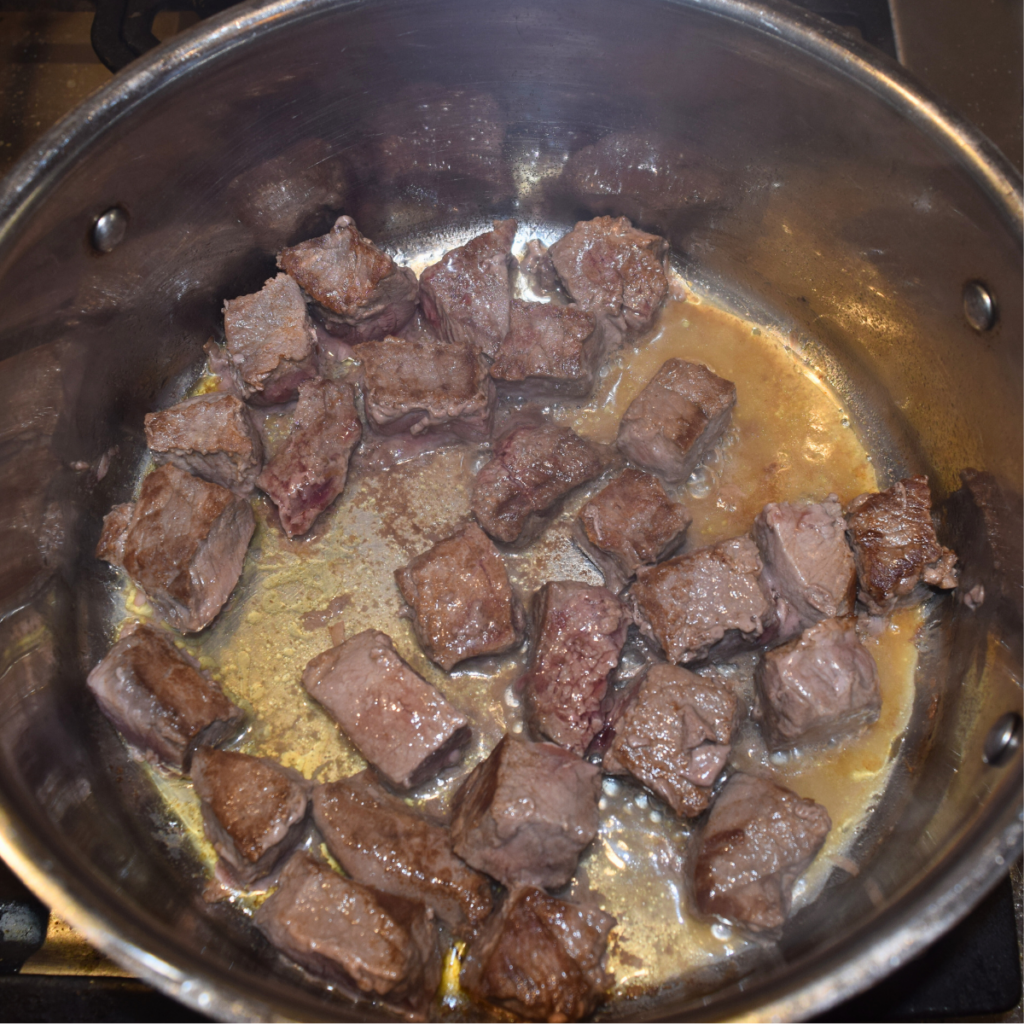 An Easy And Delicious Beef Stew Meat Browning In The Pot