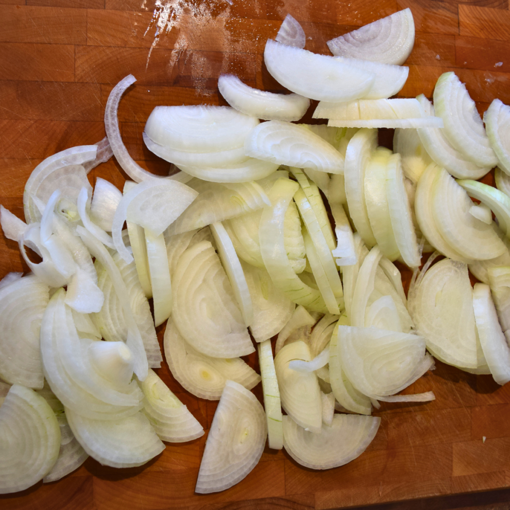 Easy and Delicious Beef Stew Onions Sliced on Cutting Board